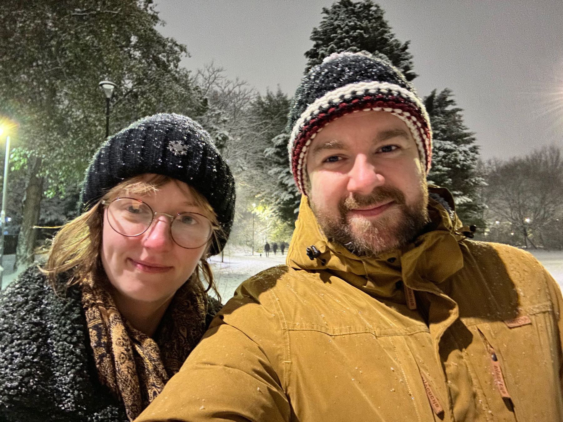 Me and Charlotte stood in the snow with a light woodland backdrop