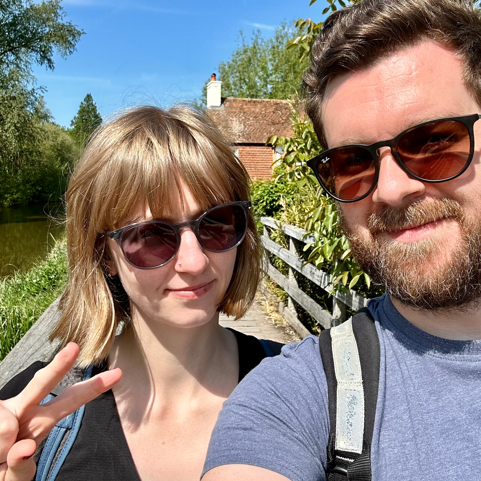 Me and Charlotte standing on a bridge by the canal. The sun is shining and everything is very green
