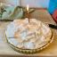 The lemon meringue pie that Charlotte baked for me, with a single lit candle.