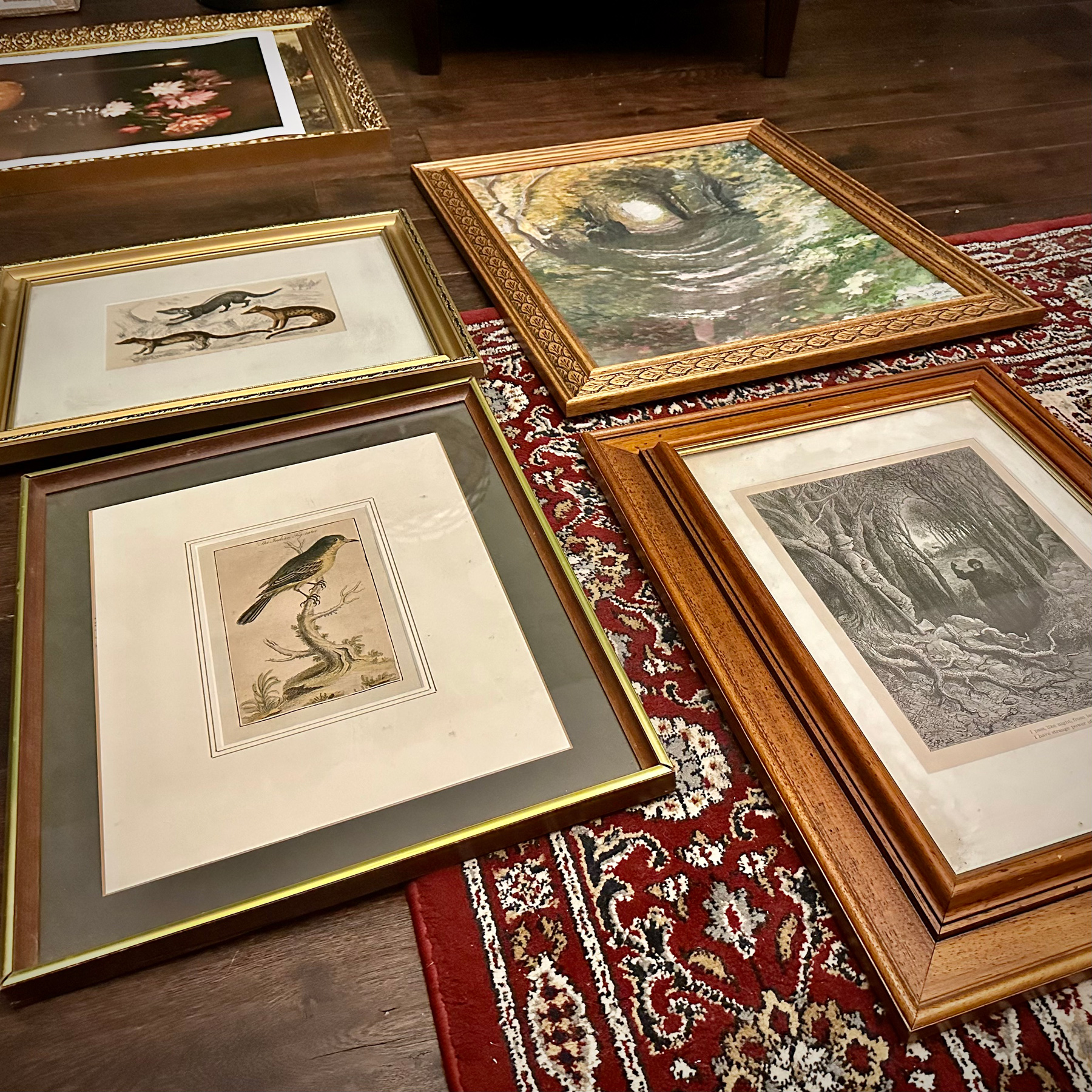 Four framed prints laid out in a grid