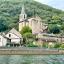 A view of the church and several houses in Lincou, pictured from the river