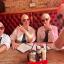 A group of us all wearing bald caps and aviators. We're wearing white shirts with a black tie and we look like a crowd of Pitbulls