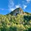 A view up to Thor's Cave from down in the valley, it's a large opening in the side of a cliff face