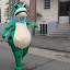 Me dressed as a large inflatable frog, strutting down the street
