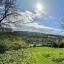 A view over Matlock Green from up on the hill, the sun's shining and everything is green
