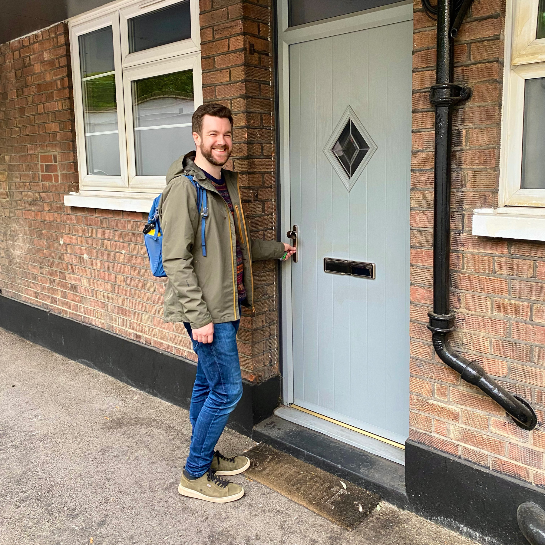 Me with a shit-eating grin, opening my front door for the first time