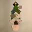A series of paint patches gathered together to form the shape of a Christmas tree