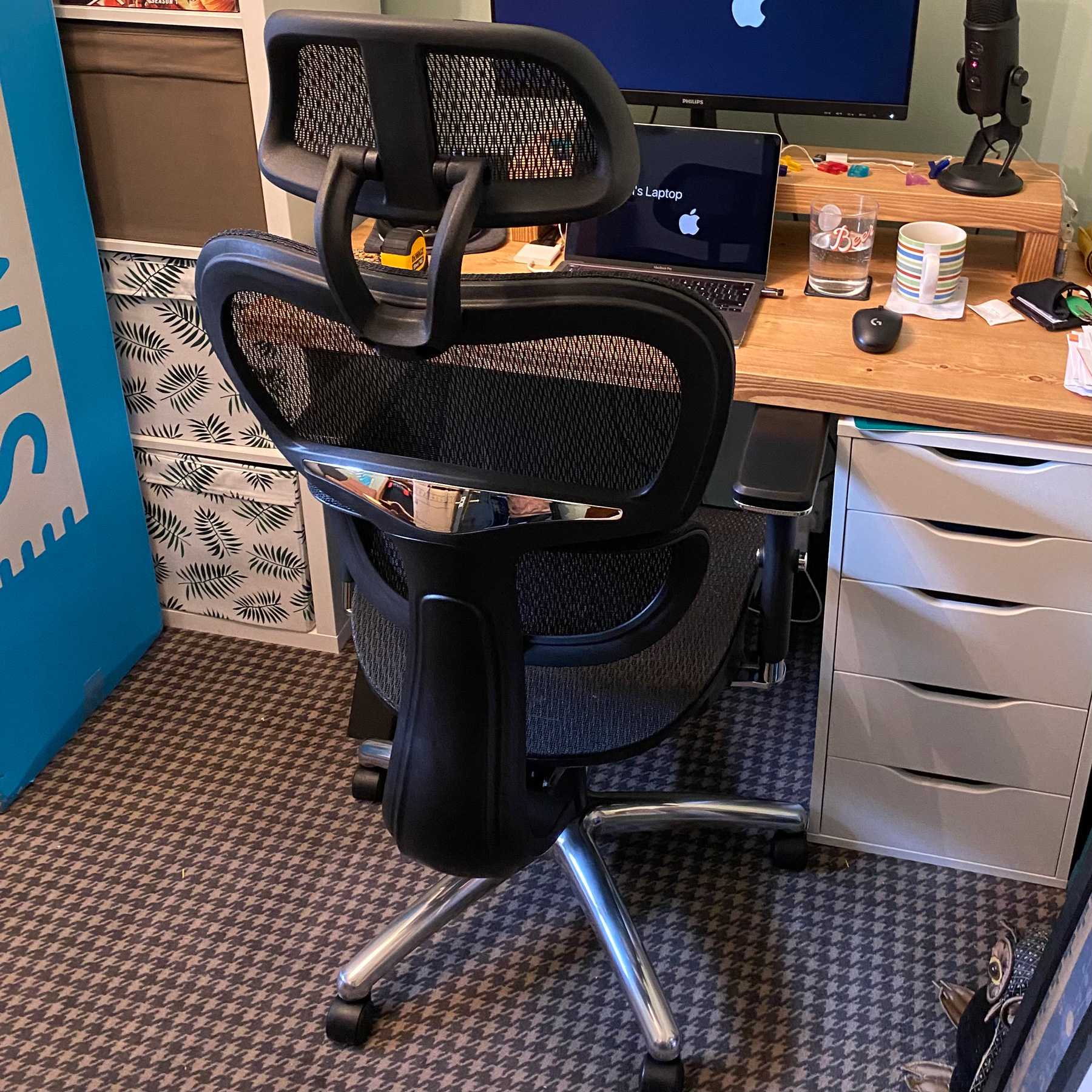 A new desk chair and a messy desk