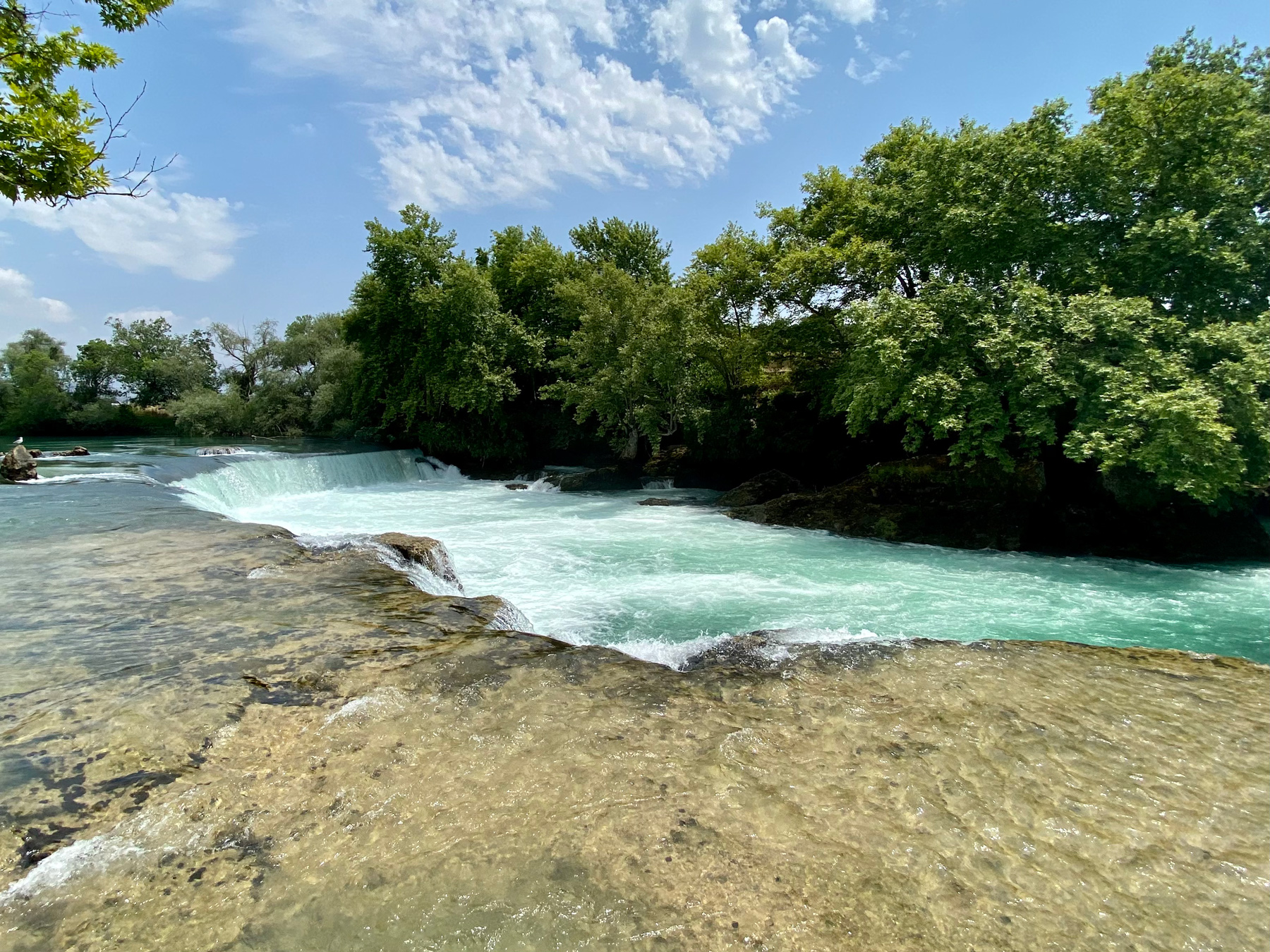 A short waterfall with frothing water