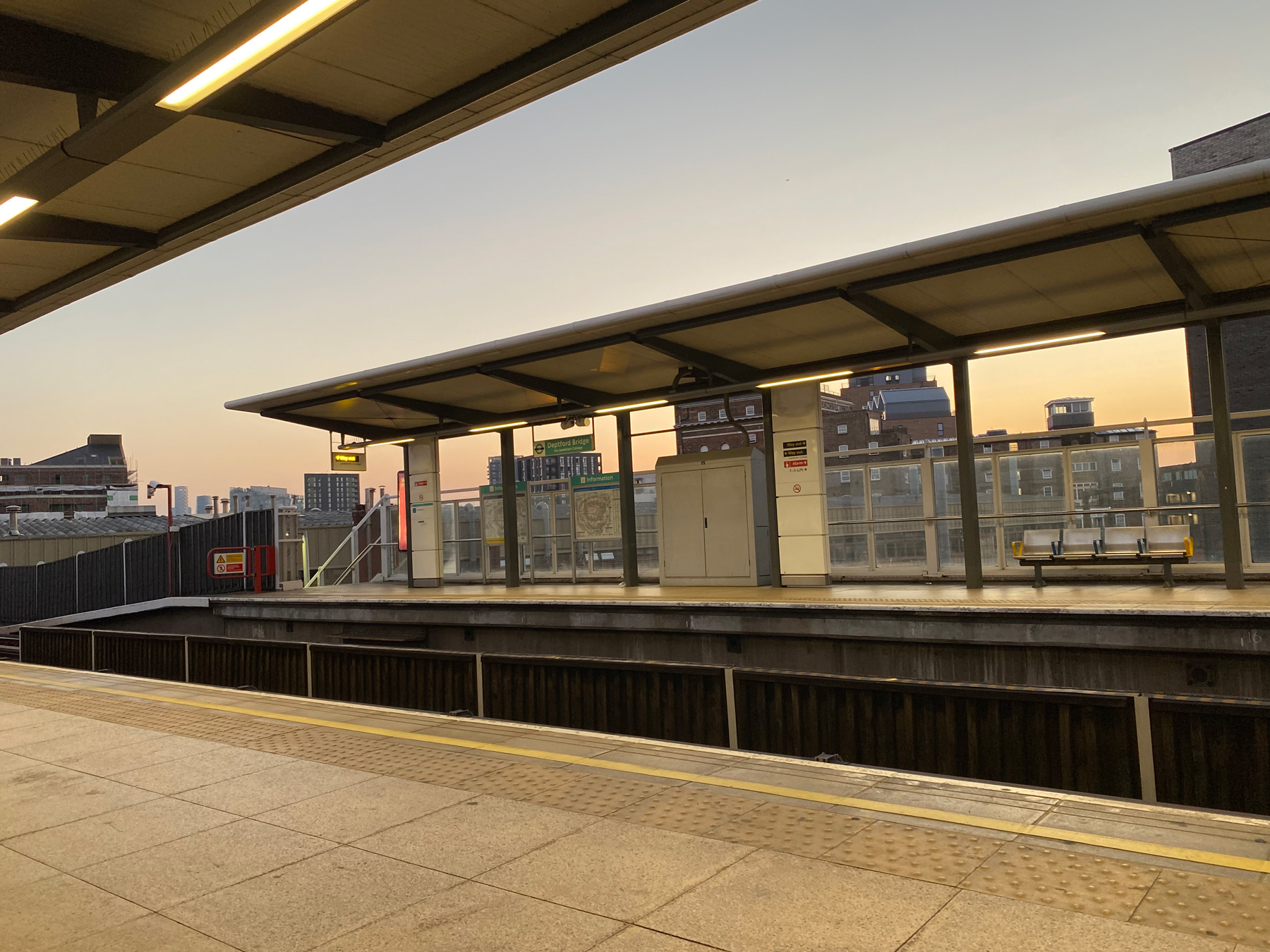 A view of the sunrise behind Deptford Bridge station